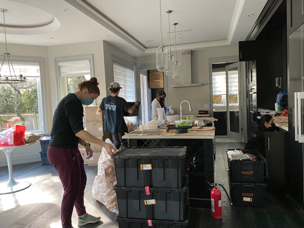 professional packers packing a kitchen in a residential house